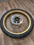 1985 Suzuki RM250 Gold Front Wheel Assembly 54111-14501 With Disc. Fixed Price $100.00.